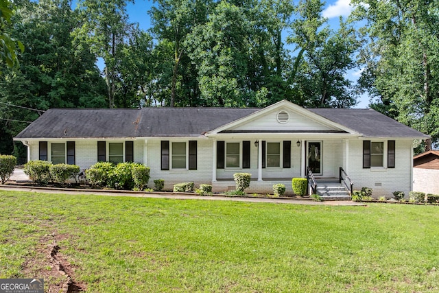 3210 Roseheath Ln, Lithonia, GA 30038 - ranch-style home featuring brick siding, a porch, a front yard, and a shingled roof