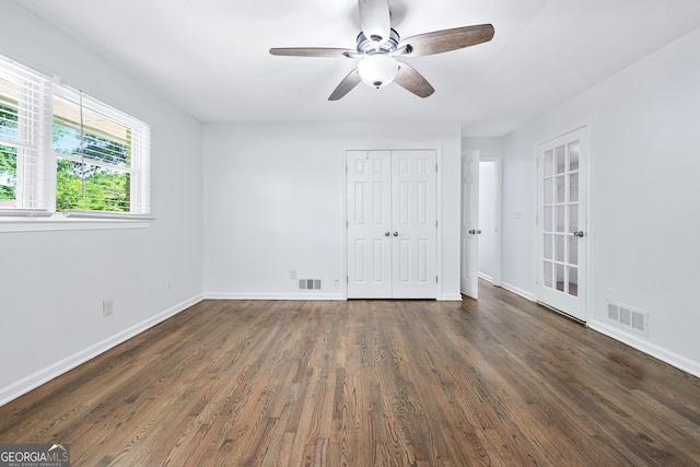 3210 Roseheath Ln, Lithonia, GA 30038 - unfurnished bedroom with wood finished floors, baseboards, a closet, and a ceiling fan