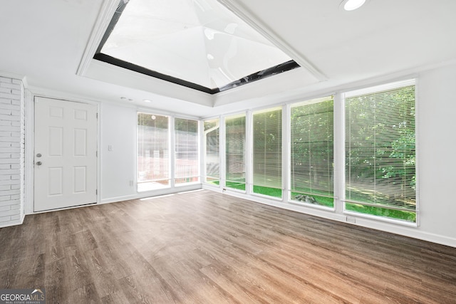 3210 Roseheath Ln, Lithonia, GA 30038 - spare room featuring wood finished floors, a raised ceiling, ornamental molding, recessed lighting, and baseboards
