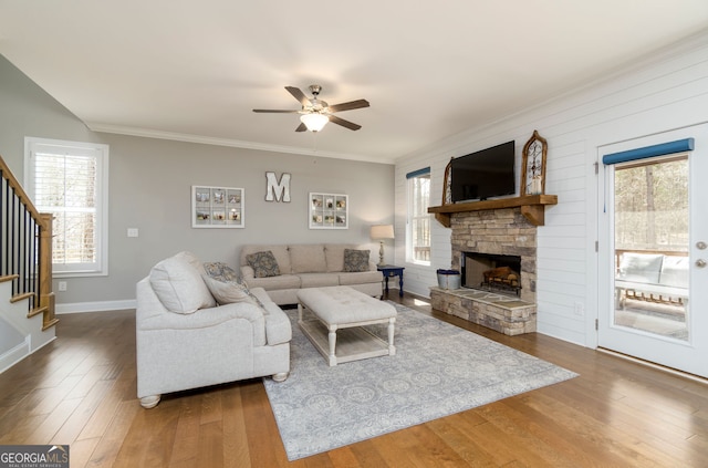 15 Jamilee Cv, Cartersville, GA 30120 - living area featuring stairway, a ceiling fan, wood finished floors, plenty of natural light, and ornamental molding