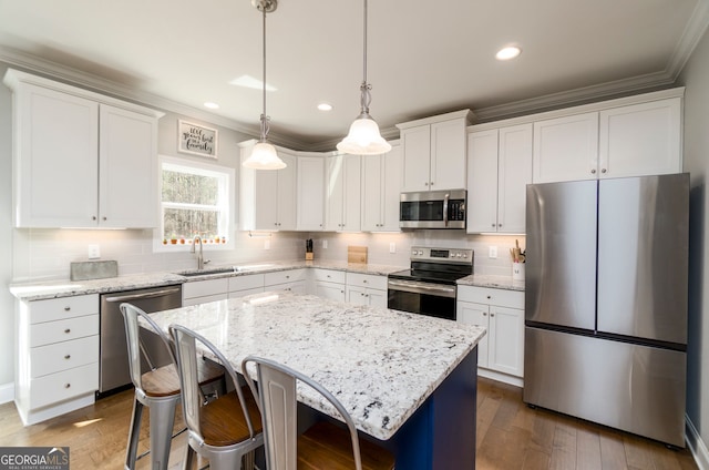15 Jamilee Cv, Cartersville, GA 30120 - kitchen featuring stainless steel appliances, a sink, ornamental molding, white cabinets, and recessed lighting