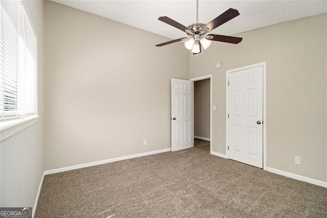 2641 Clifton Springs Rd, Decatur, GA 30034 - unfurnished bedroom with carpet floors, vaulted ceiling, baseboards, and ceiling fan
