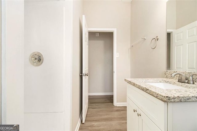 2641 Clifton Springs Rd, Decatur, GA 30034 - bathroom featuring vanity, wood finished floors, and baseboards