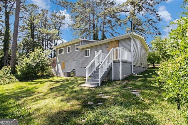2641 Clifton Springs Rd, Decatur, GA 30034 - rear view of house with a lawn and central AC unit