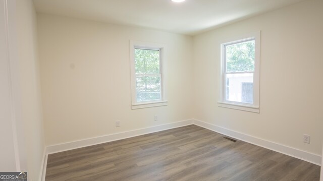71 Cold Springs Rd, Warm Springs, GA 31830 - unfurnished room featuring plenty of natural light, dark wood-style flooring, and baseboards