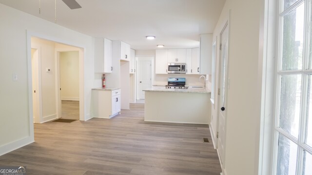71 Cold Springs Rd, Warm Springs, GA 31830 - kitchen with appliances with stainless steel finishes, a sink, white cabinets, and plenty of natural light