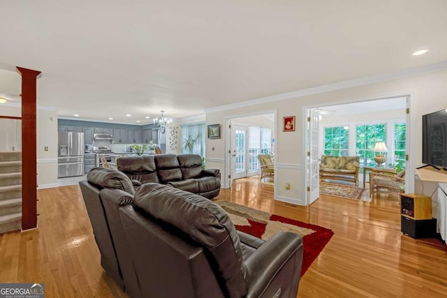222 Mossy Pl, Alpharetta, GA 30005 - living area with stairs, light wood finished floors, ornamental molding, a chandelier, and recessed lighting