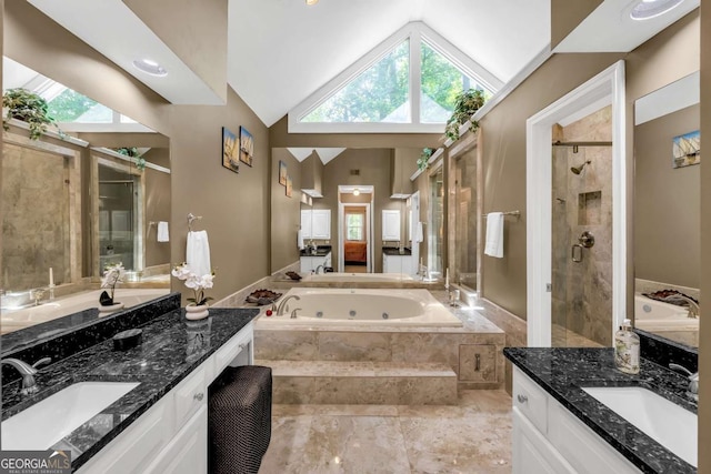 222 Mossy Pl, Alpharetta, GA 30005 - bathroom featuring a stall shower, two vanities, vaulted ceiling, and a whirlpool tub
