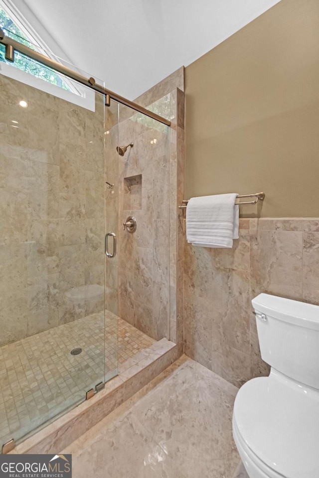 222 Mossy Pl, Alpharetta, GA 30005 - full bathroom featuring toilet, a stall shower, and a wainscoted wall