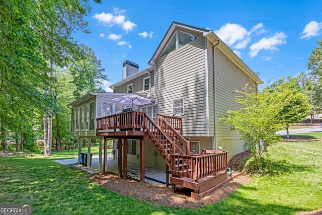 222 Mossy Pl, Alpharetta, GA 30005 - back of property with a deck, a sunroom, a lawn, and a chimney