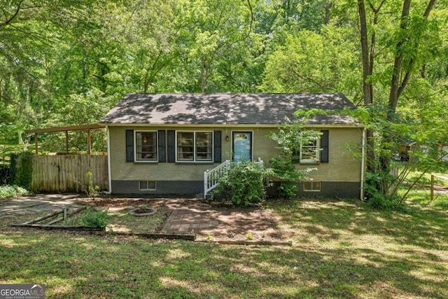 1410 Cobb Branch Dr, Decatur, GA 30032 - ranch-style home featuring brick siding, roof with shingles, and a wooded view