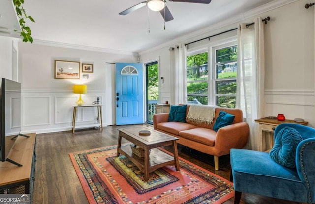 1410 Cobb Branch Dr, Decatur, GA 30032 - living room with a decorative wall, crown molding, a ceiling fan, wood finished floors, and wainscoting