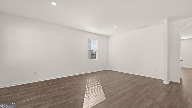 712 Curb Ct, Locust Grove, GA 30248 - spare room with dark wood-style floors, baseboards, and recessed lighting