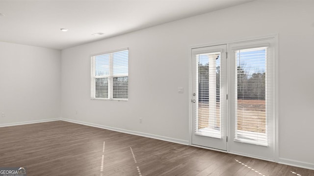 712 Curb Ct, Locust Grove, GA 30248 - unfurnished room featuring wood finished floors and baseboards