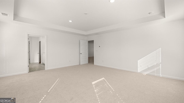 712 Curb Ct, Locust Grove, GA 30248 - empty room featuring a raised ceiling, carpet floors, recessed lighting, and baseboards