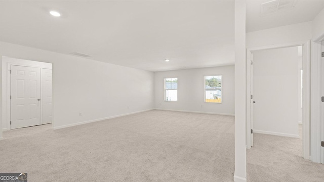 712 Curb Ct, Locust Grove, GA 30248 - empty room with light colored carpet, recessed lighting, and baseboards