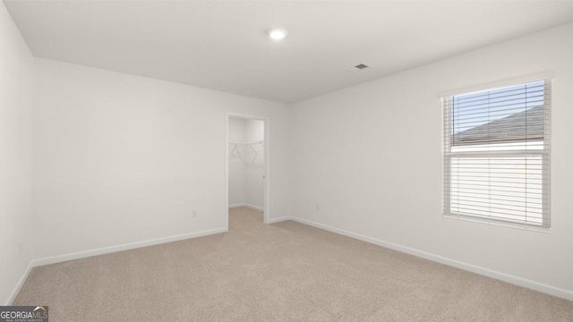 712 Curb Ct, Locust Grove, GA 30248 - empty room featuring light carpet and baseboards
