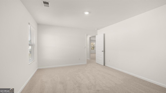 712 Curb Ct, Locust Grove, GA 30248 - unfurnished room with baseboards, plenty of natural light, and recessed lighting