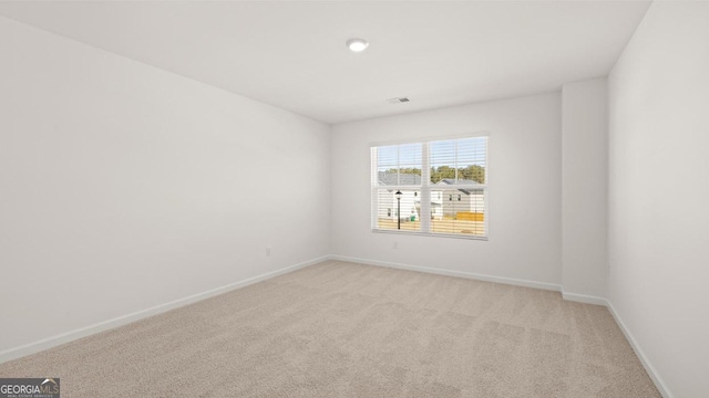 712 Curb Ct, Locust Grove, GA 30248 - unfurnished room with baseboards and light carpet