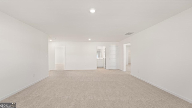 712 Curb Ct, Locust Grove, GA 30248 - spare room featuring light colored carpet, baseboards, and recessed lighting