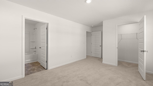 712 Curb Ct, Locust Grove, GA 30248 - unfurnished bedroom featuring carpet, a spacious closet, a closet, and baseboards