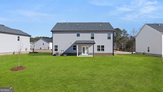 712 Curb Ct, Locust Grove, GA 30248 - rear view of house featuring a lawn, central AC, and a patio