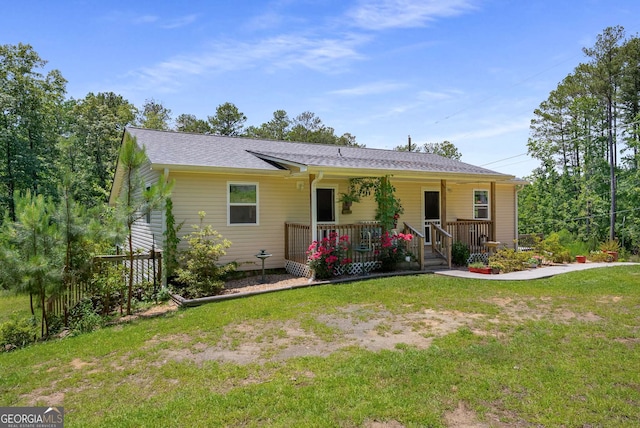 212 Postell Rd, Dallas, GA 30157 - ranch-style home with a front yard, covered porch, and a shingled roof