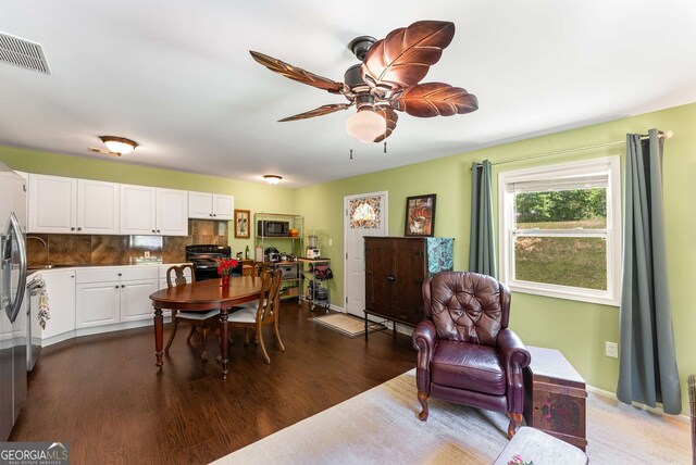 212 Postell Rd, Dallas, GA 30157 - dining room with dark wood finished floors and a ceiling fan