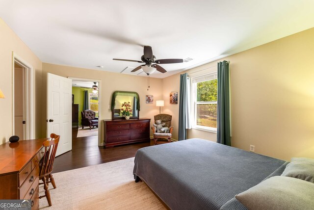 212 Postell Rd, Dallas, GA 30157 - bedroom featuring wood finished floors, ceiling fan, and a desk