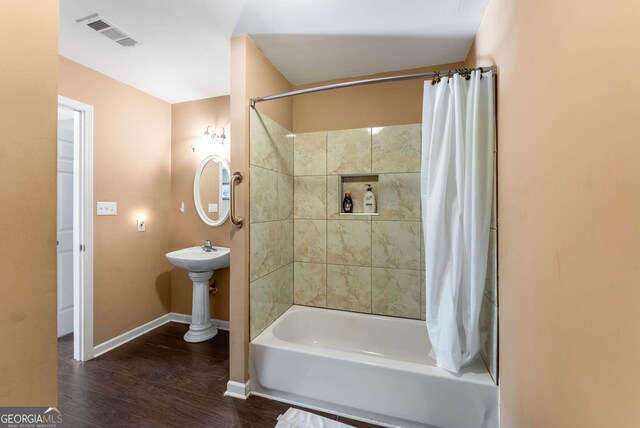 212 Postell Rd, Dallas, GA 30157 - full bath featuring shower / bathtub combination with curtain and wood finished floors