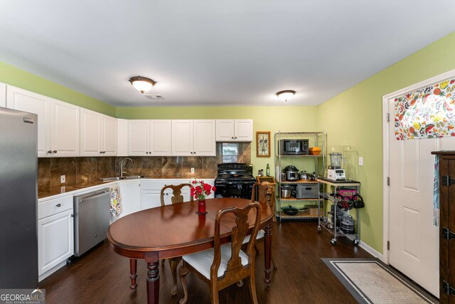 212 Postell Rd, Dallas, GA 30157 - kitchen featuring appliances with stainless steel finishes, white cabinets, and dark wood-style floors
