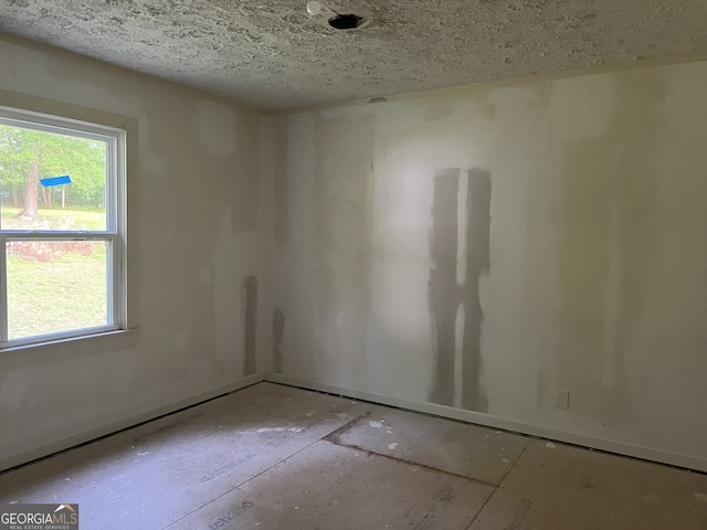 3831 Dillard St, Powder Springs, GA 30127 - spare room featuring a textured ceiling