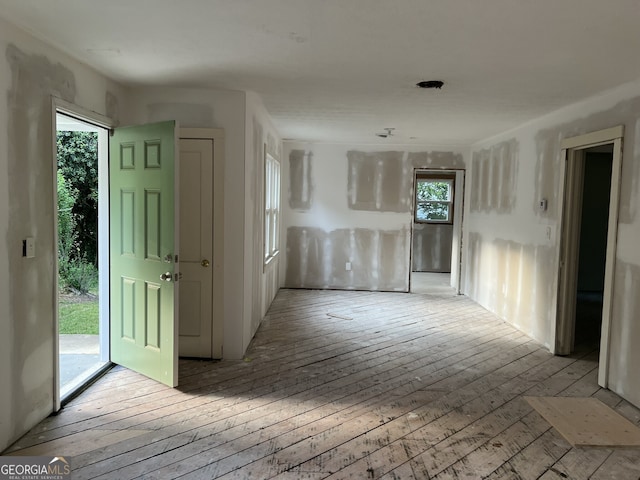 3831 Dillard St, Powder Springs, GA 30127 - spare room featuring hardwood / wood-style flooring and healthy amount of natural light