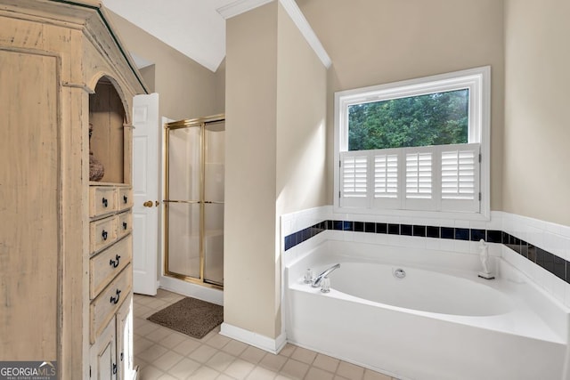 4174 Chatham Crest Ln, Buford, GA 30518 - bathroom with a bath, a shower stall, lofted ceiling, and tile patterned floors