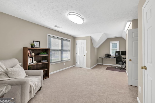 4174 Chatham Crest Ln, Buford, GA 30518 - home office featuring light carpet, baseboards, a textured ceiling, and lofted ceiling