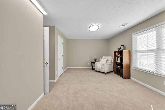 4174 Chatham Crest Ln, Buford, GA 30518 - sitting room with light carpet, a textured ceiling, and baseboards