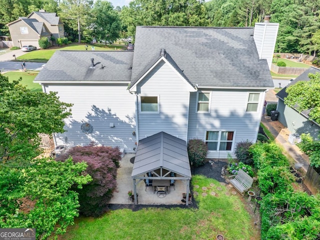 4174 Chatham Crest Ln, Buford, GA 30518 - back of house with a gazebo, a chimney, roof with shingles, and a patio
