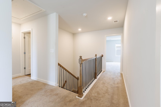 1225 Hibiscus Way, Mcdonough, GA 30253 - hallway featuring carpet flooring, an upstairs landing, attic access, baseboards, and recessed lighting
