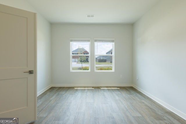 1225 Hibiscus Way, Mcdonough, GA 30253 - empty room featuring wood finished floors and baseboards