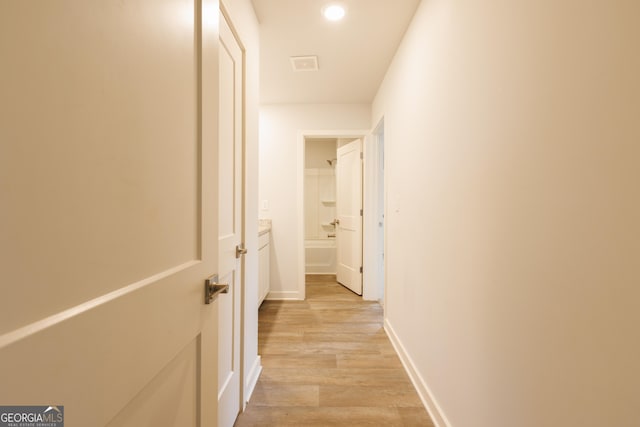 1225 Hibiscus Way, Mcdonough, GA 30253 - corridor featuring light wood-style flooring, baseboards, and recessed lighting