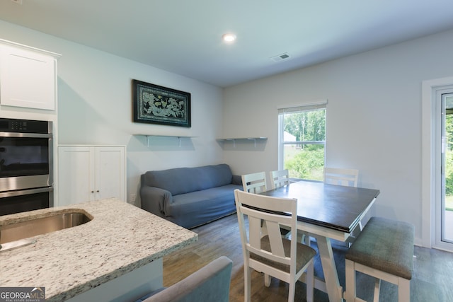 1225 Hibiscus Way, Mcdonough, GA 30253 - dining area featuring wood finished floors and recessed lighting