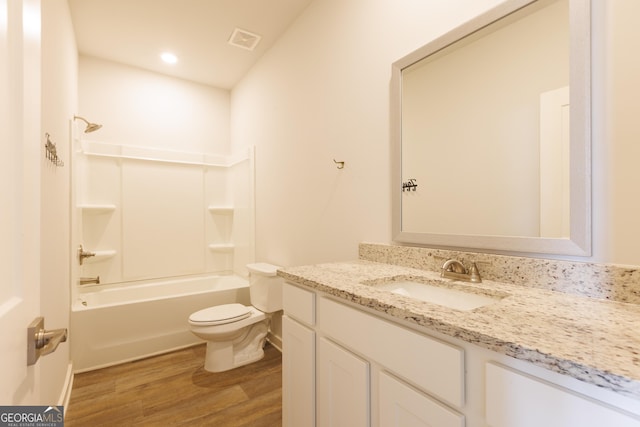 1225 Hibiscus Way, Mcdonough, GA 30253 - full bathroom featuring wood finished floors, vanity, toilet, tub / shower combination, and recessed lighting
