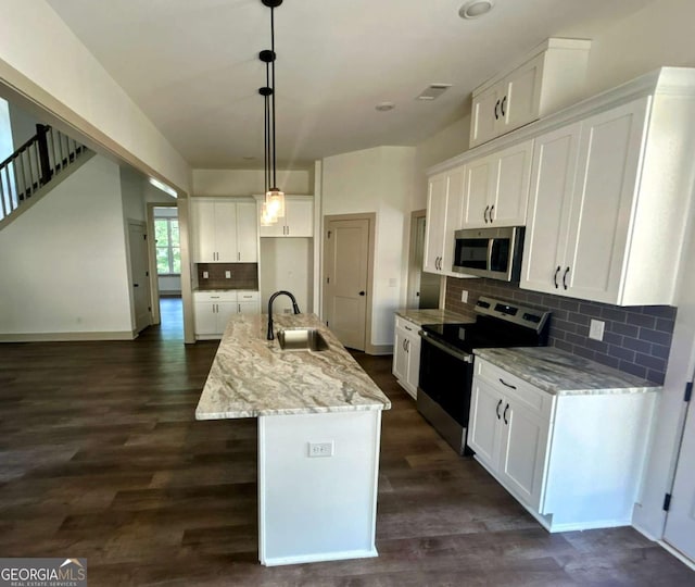 297 Ayers Creek Dr, Toccoa, GA 30577 - kitchen featuring stainless steel appliances, white cabinets, tasteful backsplash, dark wood-type flooring, and an island with sink