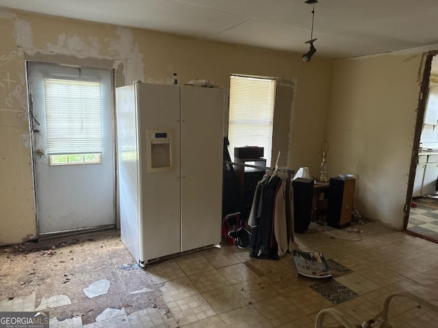 1618 Walls Rd, Sparta, GA 31087 - kitchen featuring white fridge with ice dispenser and light flooring