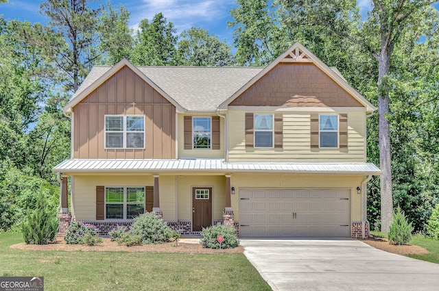 133 Coldwater Ln, Griffin, GA 30224 - craftsman-style house with a garage, concrete driveway, covered porch, a shingled roof, and board and batten siding