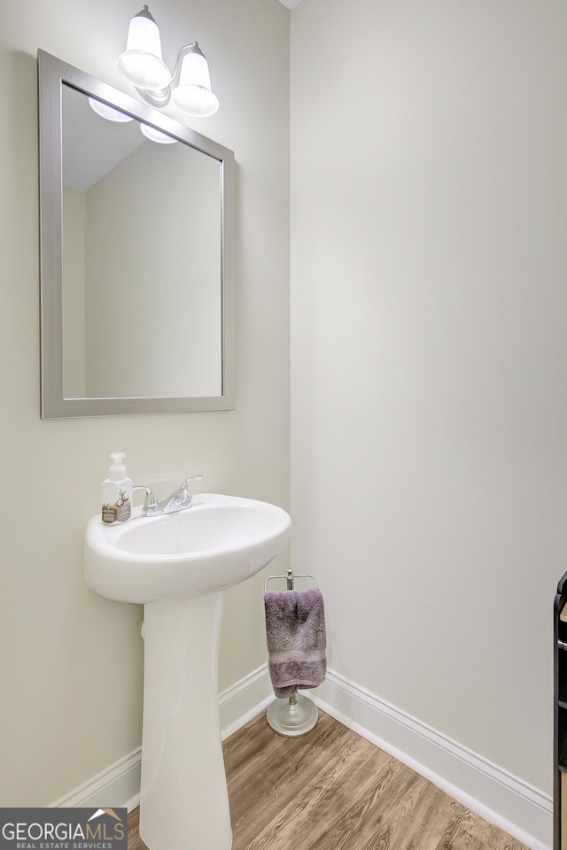 133 Coldwater Ln, Griffin, GA 30224 - bathroom featuring baseboards and wood finished floors