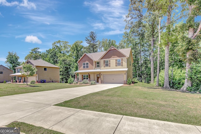133 Coldwater Ln, Griffin, GA 30224 - view of front of property with board and batten siding, driveway, an attached garage, and a front yard