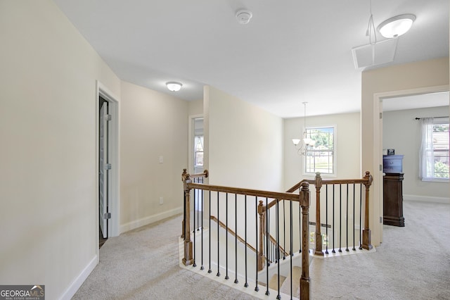 133 Coldwater Ln, Griffin, GA 30224 - hallway featuring an upstairs landing, carpet floors, and a chandelier