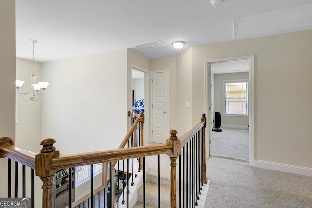 133 Coldwater Ln, Griffin, GA 30224 - corridor featuring attic access, an upstairs landing, and light carpet