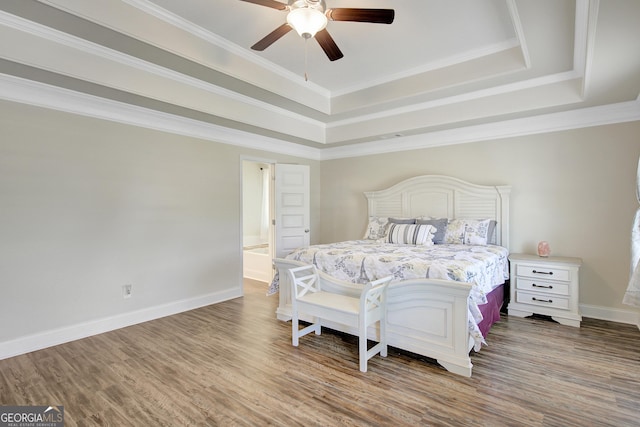 133 Coldwater Ln, Griffin, GA 30224 - bedroom featuring a tray ceiling, wood finished floors, ornamental molding, and ceiling fan